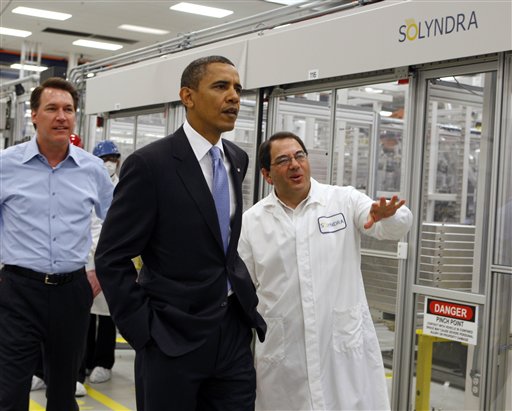FILE - In this May 26, 2010 file photo, President Obama, center, is given a tour of Solyndra by Executive Vice President Ben Bierman, right, as Chief Executive Officer Chris Gronet, left, walks along at Solyndra Inc. in Fremont, Calif. FBI spokesman Peter Lee says agents executed multiple search warrants on Thursday morning  Sept. 8, 2011 at the company's headquarters in Fremont as part of an investigation with the Department of Energy's Office of Inspector General. (AP Photo/Paul Chinn, Pool, File) (AP/Paul Chinn)