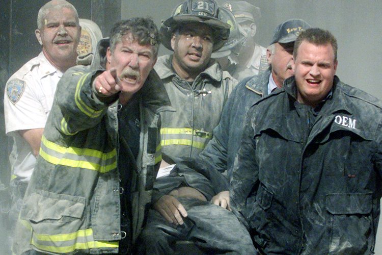 Rescue workers remove a man from the World Trade Center tower in New York
City early September 11, 2001. Both towers were hit by planes crashing into
the building. Victims from the attack on the World Trade Center - many
suffering from extensive burns - began arriving at hospitals in New York
City about an hour after two planes slammed into the twin towers, witnesses
said Tuesday. REUTERS/Shannon Stapleton

JC/ME (Reuters)