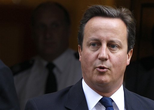 Britain's Prime Minister David Cameron leaves Downing Street in London, to attend the weekly Prime Ministers Questions in Parliament, Wednesday, Sept. 14, 2011. (AP Photo/Kirsty Wigglesworth) (AP)