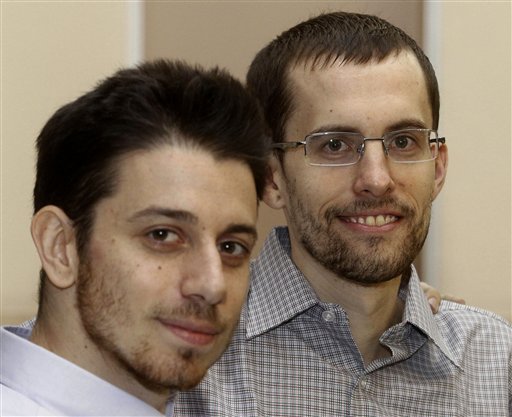 In this photo released by the Islamic Republic News Agency, IRNA, on Wednesday, Sept. 21, 2011, US hikers Shane Bauer, right, and Josh Fattal, smile, at the Tehran's Mehrabad airport before leaving Iran. Two Americans jailed in Iran as spies left Tehran on Wednesday, closing a high-profile drama with archfoe Washington that brought more than two years of hope then heartbreak for the families as the Islamic Republic's hard-line rulers rejected international calls for their release. (AP Photo/IRNA, Ehsan Nederipour) (AP Photo/IRNA, Ehsan Nederipour)