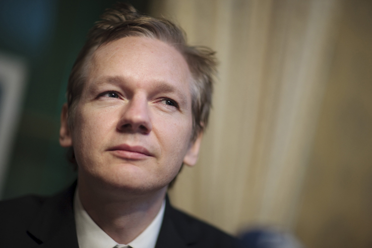 WikiLeaks founder Julian Assange attends a news conference at the Geneva Press Club in Geneva, in this November 4, 2010 file photo. WikiLeaks founder Julian Assange said on December 3, 2010 that he and colleagues were taking steps to protect themselves after death threats following the publication of leaked U.S. diplomatic cables on their website. One of Assange's lawyers said he would also fight any attempt to extradite his client to face questions over alleged sexual misconduct, adding that he believed foreign powers were influencing Sweden in the matter. REUTERS/Valentin Flauraud/Files (SWITZERLAND - Tags: POLITICS CONFLICT MILITARY MEDIA HEADSHOT) BEST QUALITY AVAILABLE (Â© Valentin Flauraud / Reuters)