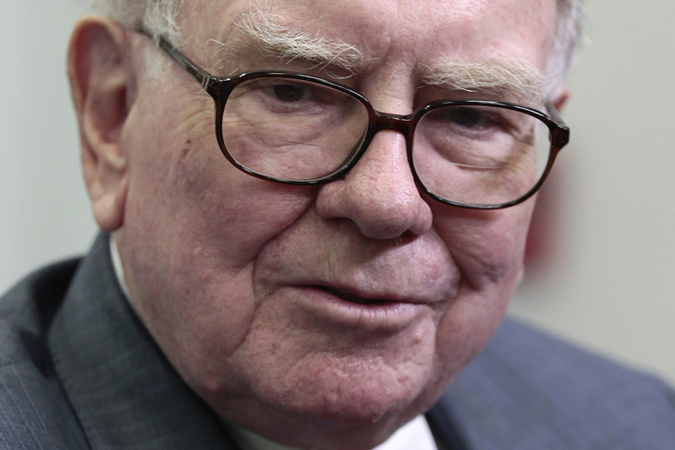 Warren Buffett is interviewed in the White House Briefing Room in Washington, Monday, July 18, 2011, following his meeting with President Barack Obama. Obama met with members of the Giving Pledge including, Buffett and Bill and Melinda Gates, and others to receive and update on the program. (AP Photo/Pablo Martinez Monsivais) (Pablo Martinez Monsivais)
