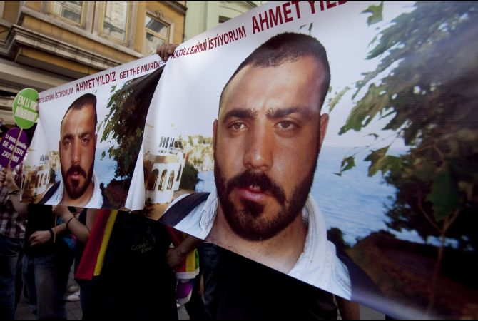 Demonstrators tried to raise awareness of the 2008 murder of Ahmet Yildiz ("Get the Murderers" is written above the victim's photo) during a gay pride march in Istanbul on June 26, 2011 (Jodi Hilton/GlobalPost)