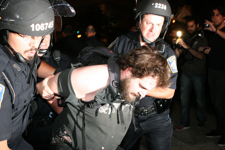 Boston Police arrest a demonstrator on Oct. 10, 2011. (<span about='http://www.flickr.com/photos/31167233@N08/6234070462/' xmlns:cc='http://creativecommons.org/ns#'><a href='http://www.flickr.com/photos/31167233@N08/6234070462/' rel='cc:attributionURL' target='_blank'>Paul Weiskel</a> / <a href='http://creativecommons.org/licenses/by/3.0/' rel='license' target='_blank'>CC BY 3.0</a></span>)