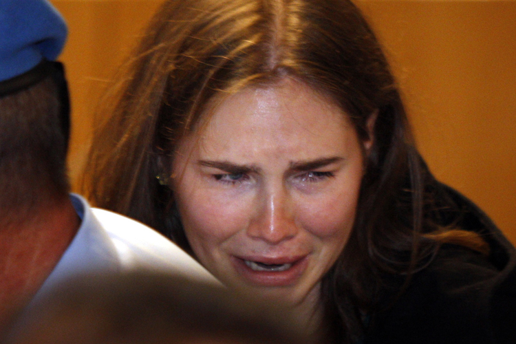 Amanda Knox breaks in tears after hearing the verdict that overturns her conviction and acquits her of murdering her British roommate Meredith Kercher, Monday, Oct. 3, 2011. (AP/Pier Paolo Cito)