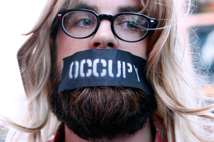 An Occupy Wall Street protester at a demonstration at Times Square on Oct. 15. (Reuters/Allison Joyce)