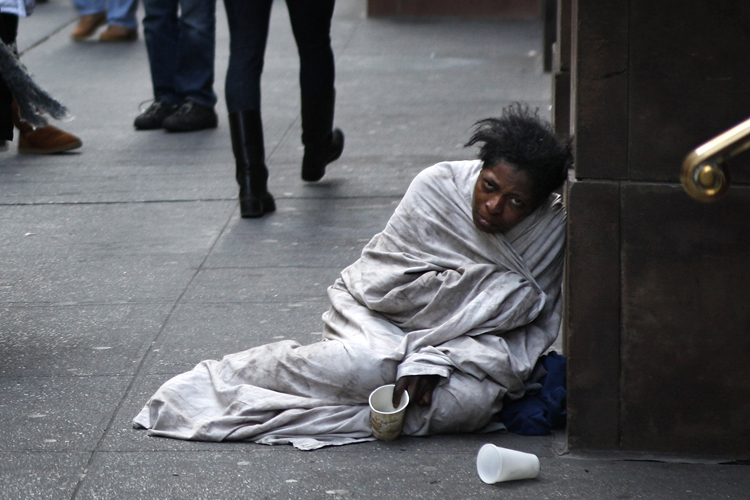 A panhandler begs for money on Fifth Avenue in New York December 8, 2009 (Finbarr O'reilly / Reuters)
