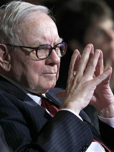 Berkshire Hathaway Inc. Chairman Warren Buffett listens to Secretary of State Hillary Rodham Clinton speak in Washington in 2010. (AP/J. Scott Applewhite)