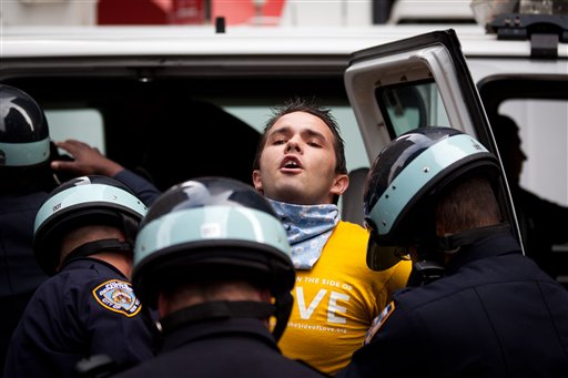 Occupy Wall Street protestor Lincoln Statler is arrested along with several others in the financial district's Zucotti park, Monday, Oct. 3, 2011. (AP Photo/John Minchillo)