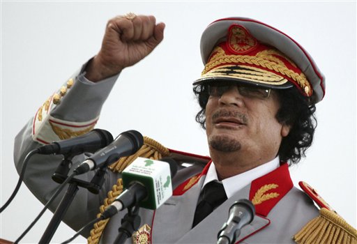 In this Saturday, June 12, 2010 file photo, Libyan leader Moammar Gadhafi talks during a ceremony to mark the 40th anniversary of the evacuation of the American military bases in the country, in Tripoli, Libya. (AP Photo/ Abdel Magid Al Fergany, File)
