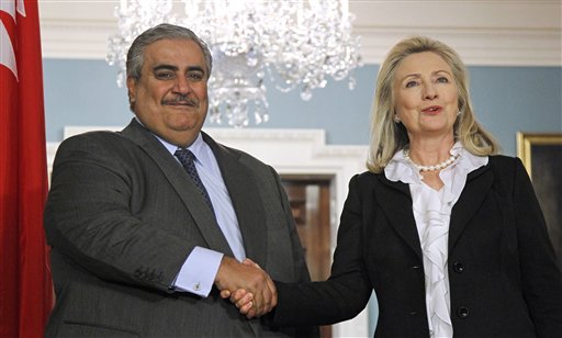 Secretary of State Hillary Rodham Clinton shakes hands with Bahrain's Foreign Minister Shaikh Khalid bin Ahmed al-Khalifa after delivering a statement, Wednesday, Oct. 26, 2011, at the State Department in Washington. (AP Photo/Haraz N. Ghanbari)