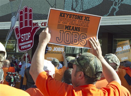 Demonstrators for and against the Keystone XL pipeline gather outside Pershing Auditorium near the state Capitol in Lincoln, Neb., Tuesday, Sept. 27, 2011. (AP/Nati Harnik)