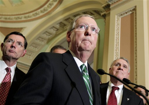 Senate Minority Leader Mitch McConnell of Ky., center, accompanied by Sen. John Barrasso, R-Wyo., left, and Senate Minority Whip Jon Kyl of Ariz., talks about President Obama's job bill, Tuesday, Oct. 4, 2011, during a news conference on Capitol Hill in Washington.  (AP Photo/J. Scott Applewhite) (AP)