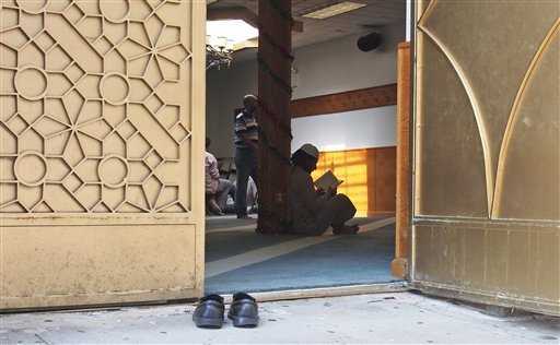In this photo taken Sept. 2, 2011, worshippers are pictured inside the Al-Iman Mosque after midday prayers in the Astoria neighborhood of the Queens borough of New York. (AP Photo/Charles Dharapak)