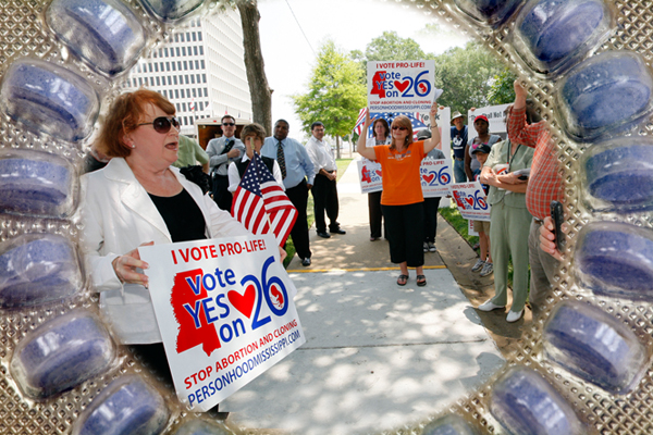 At a June 6, 2011, rally, Dr. Beverly McMillan, president of Pro-Life Mississippi, left, thanks the people gathered in Jackson, Miss., for their support on the state's proposed "personhood" amendment. (iStockphoto/meltonmedia/AP/Rogelio V. Solis)