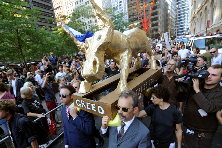 A coalition of clergy carry a "False Idol" to the Occupy Wall Street encampment in Zuccotti Park, Sunday, Oct. 9, 2011 in New York. (AP)