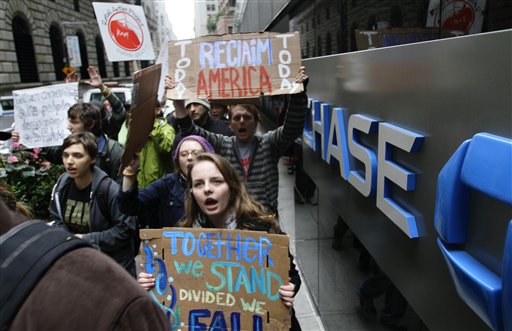 Occupy Wall Street protesters march around One Chase Manhattan Plaza on Wednesday, Oct. 12, 2011 in New York. (AP/Bebeto Matthews)