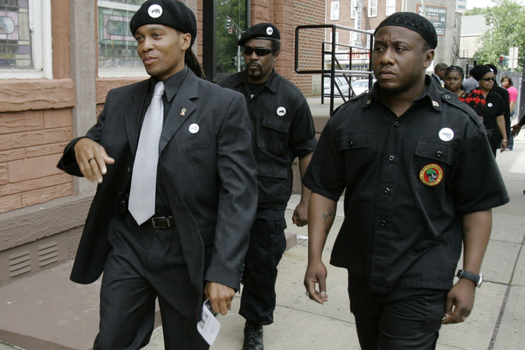 Members of the New Black Panther Party, including, Divine Allah, left, arrive for funeral services for 13-year-old shooting victim, Tamrah Leonard, at the Friendship Baptist Church in Trenton, N.J., Saturday, June 13, 2009. (AP/Mike Derer)