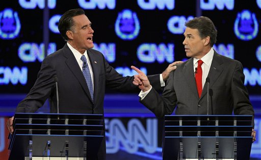 Republican presidential candidates former Massachusetts Gov. Mitt Romney, left, and Texas Gov. Rick Perry speak during a Republican presidential debate Tuesday, Oct. 18, 2011, in Las Vegas.  (AP Photo/Chris Carlson) (AP)