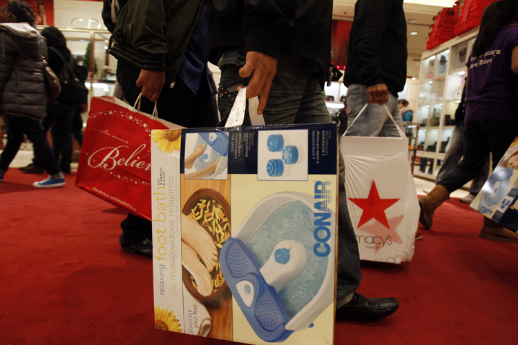 Shoppers leaving Macy's in New York (Jessica Rinaldi / Reuters)
