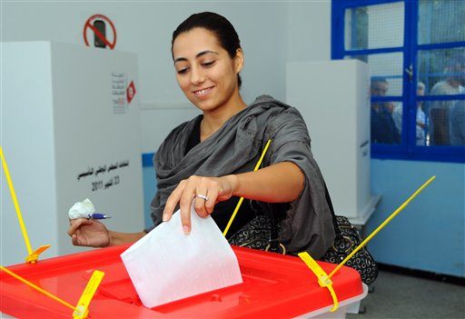 A Tunisian casts her vote in la Marsa near Tunis, Sunday Oct. 23, 2011 (AP Photo/Hassene Dridi)