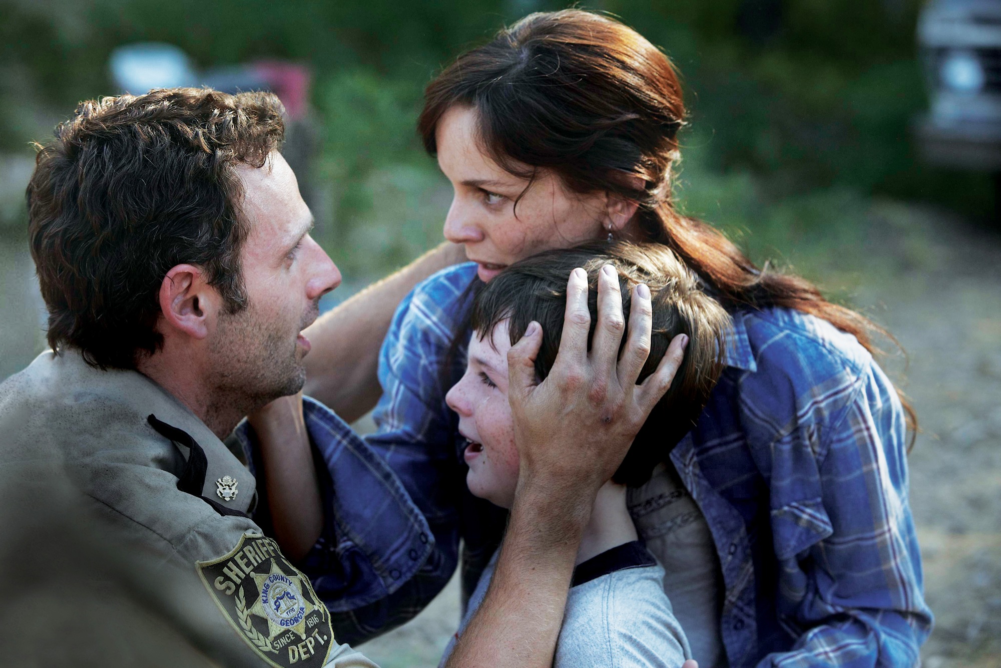 Fresh meat! Andrew Lincoln, Sarah Wayne Callies and Chandler Riggs on AMC's "The Walking Dead." (Credit: AMC.)