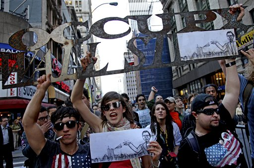 Marchers with Occupy Wall Street lead off a march that included labor unions through Lower Manhattan Wednesday, Oct. 5, 2011 (AP Photo/Craig Ruttle)