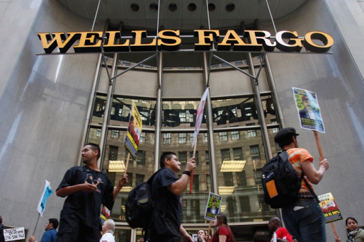 Demonstrators picket outside the Wells Fargo corporate headquarters in San Francisco. (Reuters/Stephen Lam)