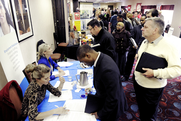 Job seekers attend the Minneapolis Career Fair held Wednesday, Nov. 2, 2011, in Bloomington, Minn. (AP/Jim Mone)