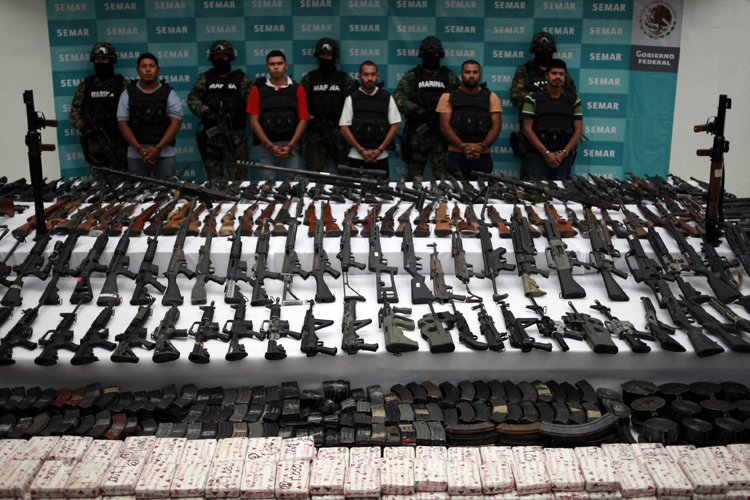 Rifles, guns, hand grenades, uniforms of the Mexican navy and the U.S. Army, cartridges and cocaine were seized in an operation against the Zetas drug cartel in Coahuila and Nuevo Leon in the north of Mexico. (Jorge Lopez / Reuters)