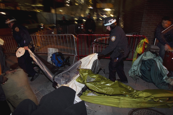 NYPD officers remove the belongings of members of Occupy Wall Street after removing members of the movement from Zuccotti Park in New York November 15, 2011. (Â© Lucas Jackson / Reuters)