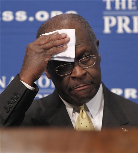 Republican presidential candidate, Herman Cain wipes his forehead before answering questions at the National Press Club in Washington, Monday, Oct., 31, 2011. Denying he sexually harassed anyone, Cain said Monday he was falsely accused in the 1990s while he was head of the National Restaurant Association, and he branded revelation of the allegations a "witch hunt.". (AP Photo/Pablo Martinez Monsivais) (AP)