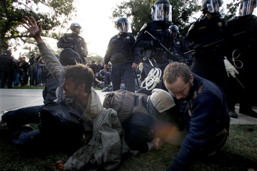 Protesters at University of California, Davis react after being pepper sprayed by police on Friday, November 18, 2011 (AP Photo/The Enterprise, Wayne Tilcock)