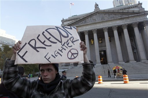 An Occupy Wall Street protester marches past New York's Supreme Court building to support his friend who was arrested Thursday, Friday, Nov. 4, 2011 (AP Photo/Mary Altaffer)