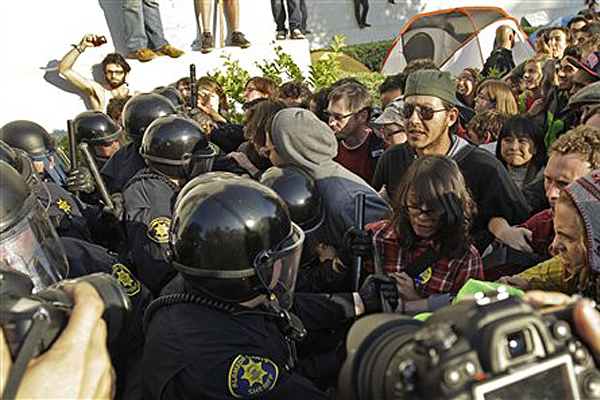 Police in riot gear clash with student activists in front of Sproul Hall on the University of California at Berkeley campus Wednesday, Nov. 9, 2011, in Berkeley, Calif. (AP/Ben Margot)