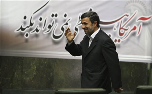 Iranian President Mahmoud Ahmadinejad, waves, as he arrives to attend an open session of parliament in Tehran, Iran, Tuesday, Nov. 1, 2011. (AP/Vahid Salemi)