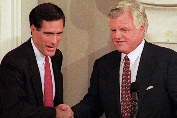 Democratic Senator Ted Kennedy (R) and his Republican challenger Mitt Romney shake hands at the start of their first debate of the campaign for the US Senate at Boston's Faneuil Hall on October 25, 1994. (Reuters)