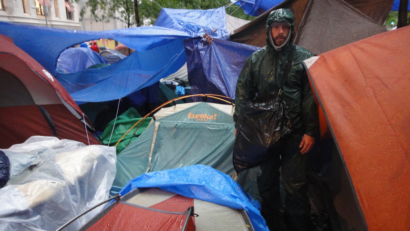 The author braves the rain at Zuccotti Park, as part of the Occupy Wall Street demonstration