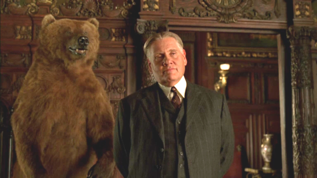 Two of a kind: The Commodore's stuffed grizzly looms behind Philadelphia gangster Manny Horvitz (Williams Forsythe) on "Boardwalk Empire.) (HBO)