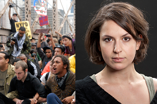 Protesters sit with arms linked on New York's Brooklyn Bridge before police began making arrests on Oct. 1 and author Natasha Lennard.