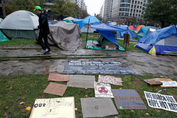 A demonstrator walks through the Occupy DC McPherson Square camp. (Reuters/Jose Luis Magaua)