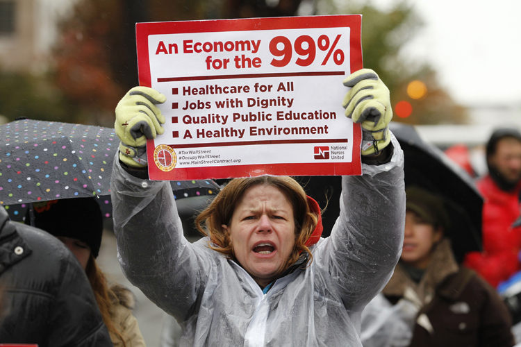 Occupy K Street demonstrators protest on a street in Washington (Jose Luis Magaua / Reuters)