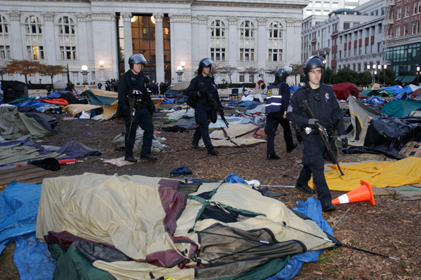 Police in Oakland began clearing out a weeks-old encampment early Monday, after issuing several warnings to Occupy demonstrators. (AP/Paul Sakuma)