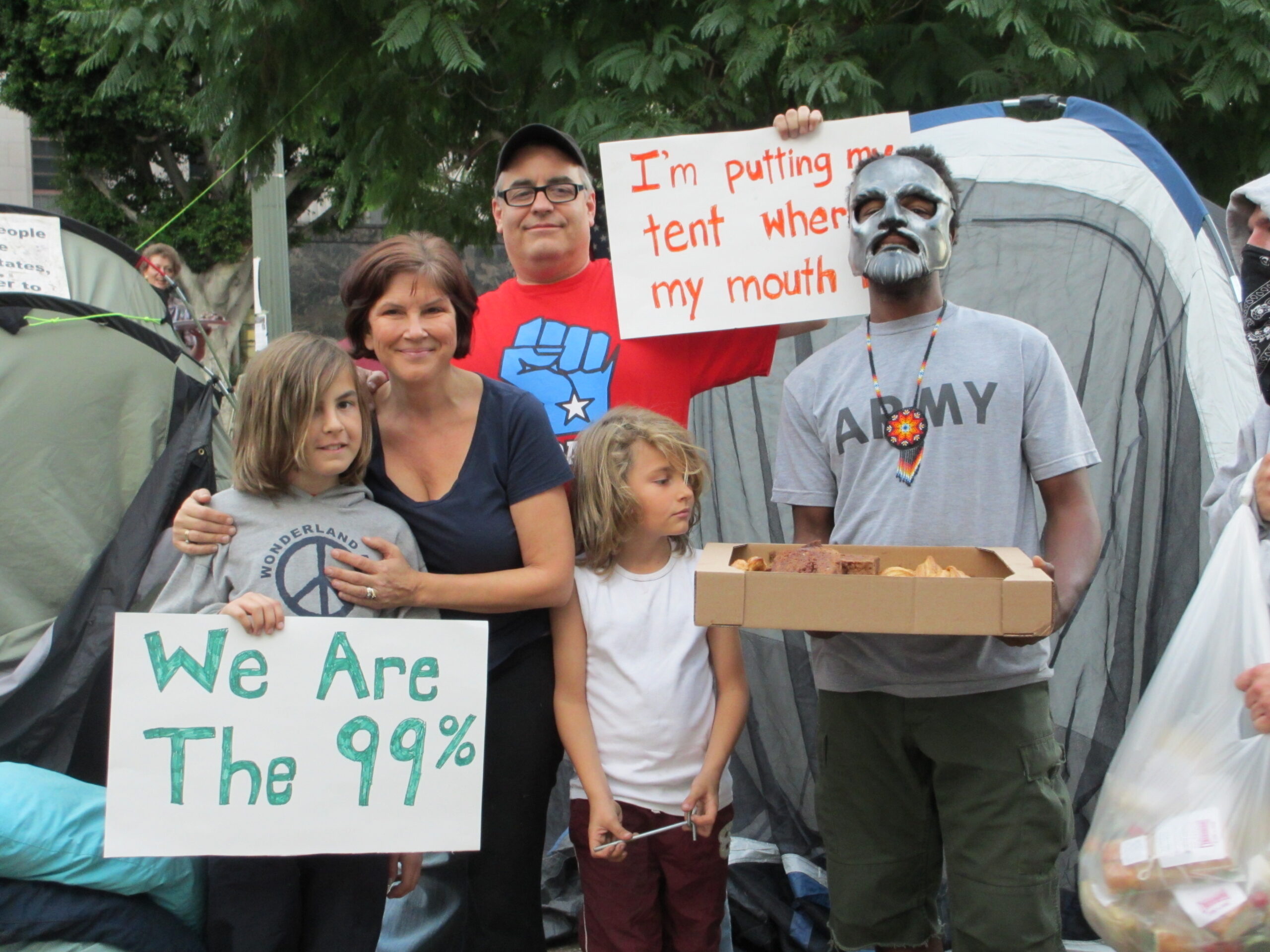 A photo of the author with her family and an Occupy Los Angeles protester