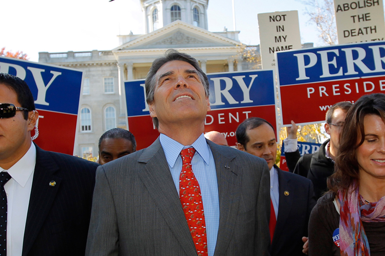 Republican presidential candidate Texas Governor Rick Perry (C) leaves the New Hampshire State House after filing the paperwork for his name to appear on the primary ballot in Concord, New Hampshire (Reuters)