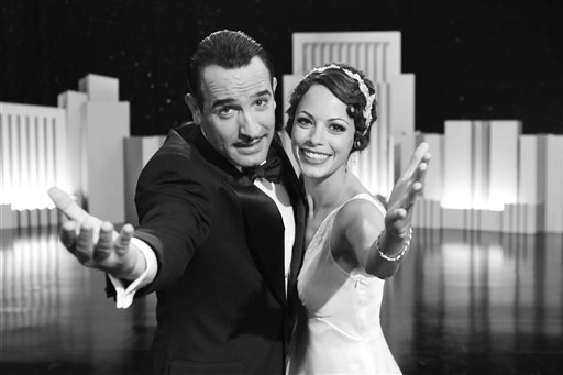 In this film publicity image released by The Weinstein Company, Jean Dujardin portrays George Valentin, left, and Berenice Bejo portrays Peppy Miller in a scene from "The Artist." (AP/The Weinstein Company)