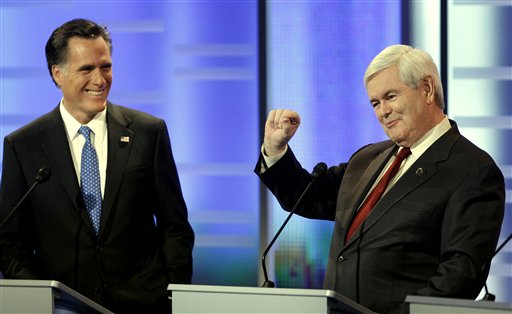 Republican presidential candidates former Massachusetts Gov. Mitt Romney, left, and former Speaker of the House Newt Gingrich, right, take part in the Republican debate, Saturday, Dec. 10, 2011, in Des Moines, Iowa. (AP Photo/Charlie Neibergall) (AP)