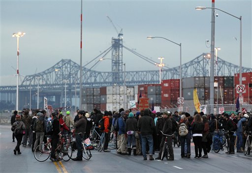 Protesters block one of the entrances to the Port of Oakland on Monday Dec. 12. (AP)