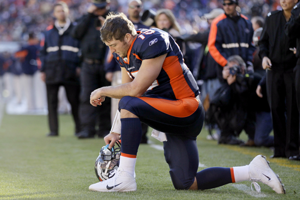 Denver Broncos quarterback Tim Tebow (15) prays in the end zone before the start of an NFL football game against the Chicago Bears, Sunday, Dec. 11, 2011, in Denver. (AP/Julie Jacobson)