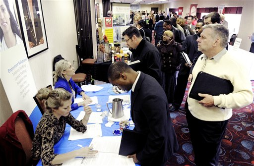 Job seekers attend the Minneapolis Career Fair held Wednesday, Nov. 2, 2011, in Bloomington, Minn. (AP Photo/Jim Mone)